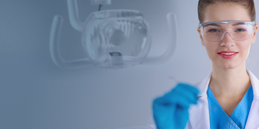 dental hygienist assisting dentist